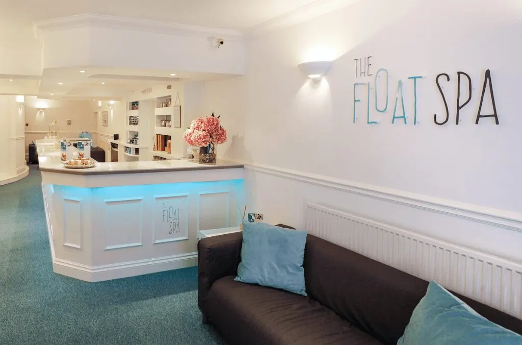 Reception desk with blue under-lighting at The Float Spa