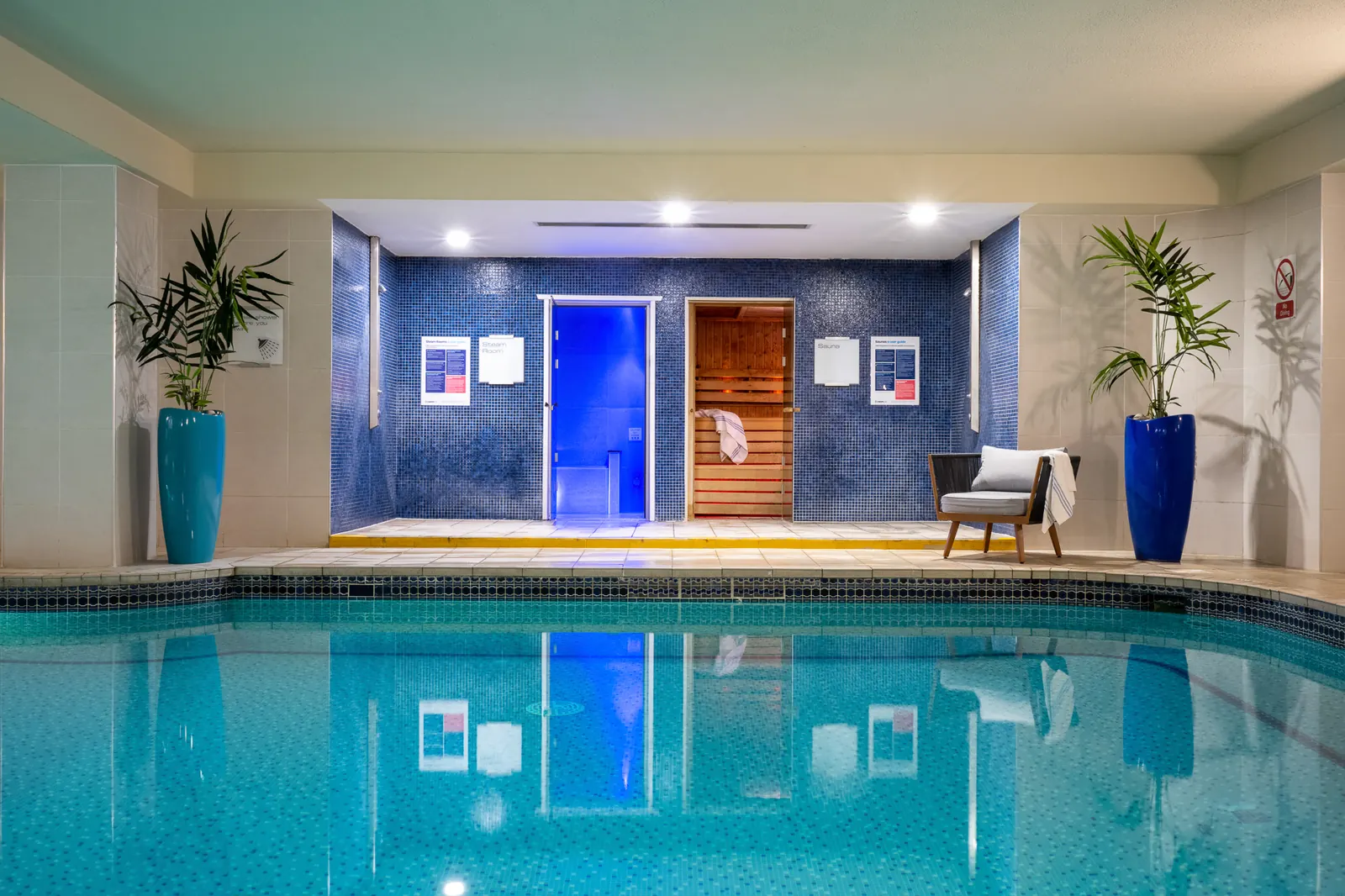 Pool with the steam room and sauna doors at the far end