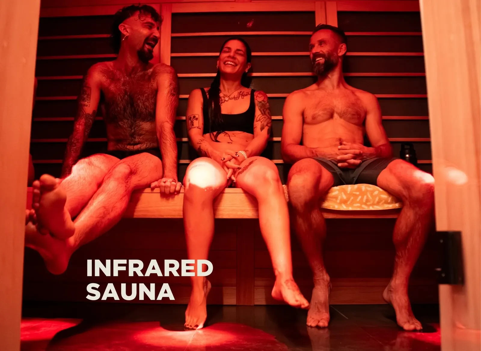 Three people sitting in the infrared sauna (photo has text overlay)