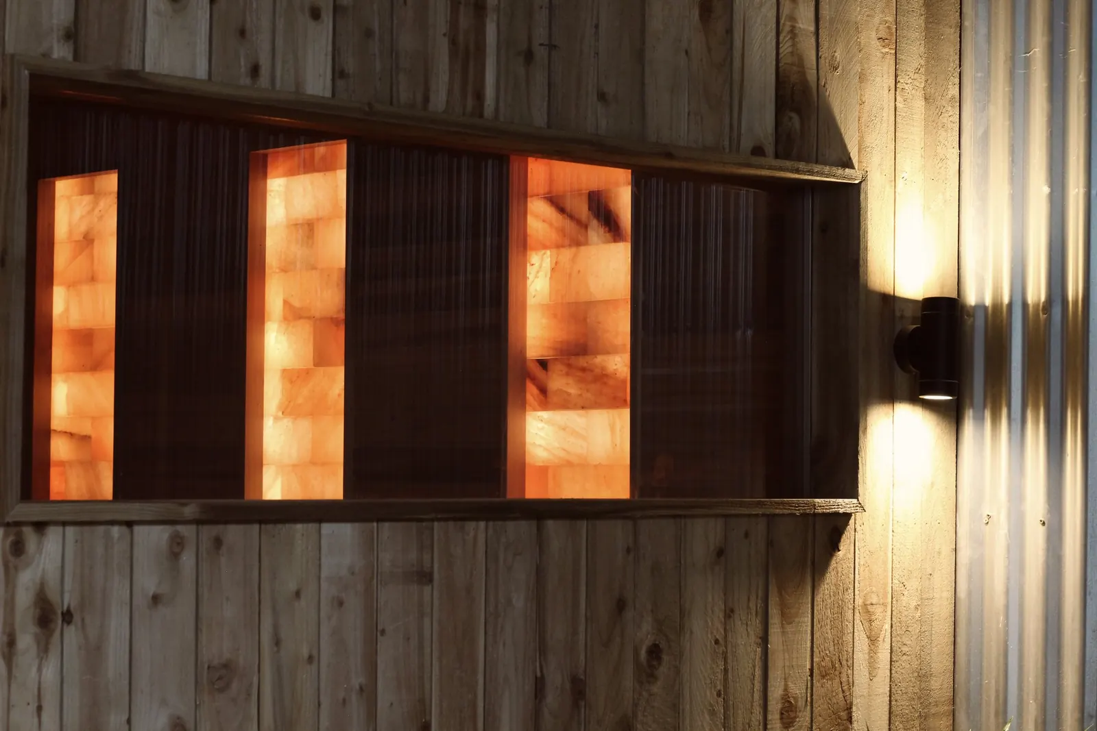 Sauna exterior with glowing Himalayan salt-block windows