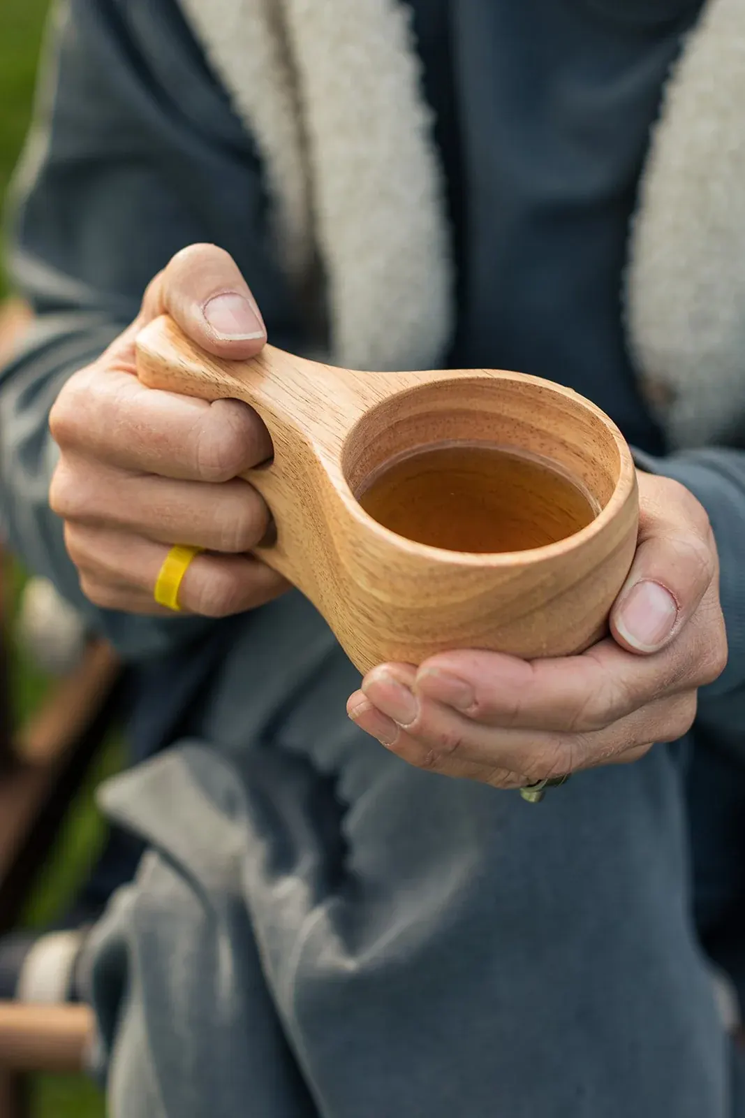 Herbal tea in a wooden kuksa cup